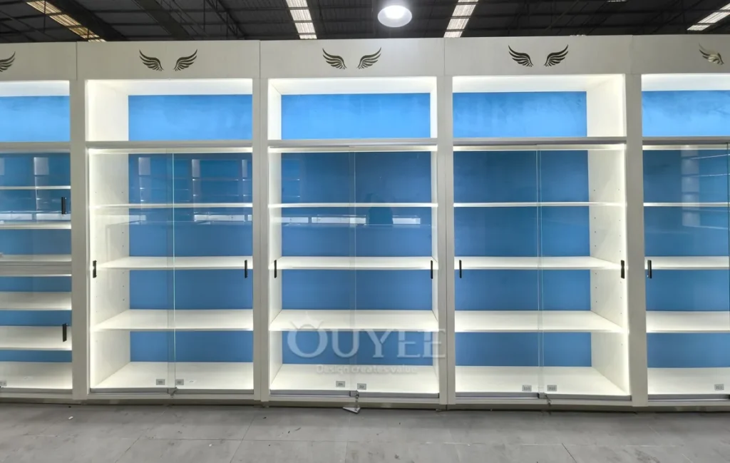 White Backlit Display Cabinet Wall with Blue Panels 01