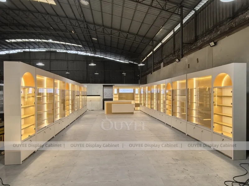 Long Beige Perfume Showroom With Backlit Arch Shelving