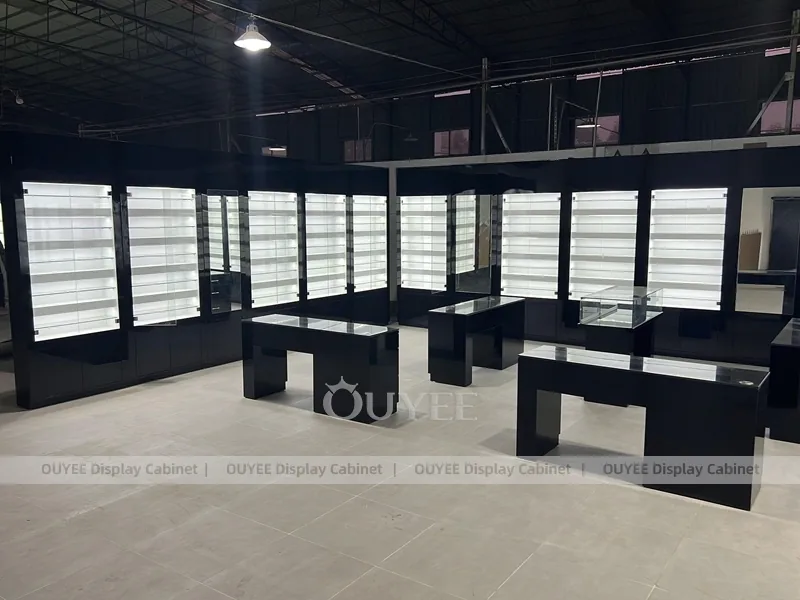 Black Optical Shop Interior with Illuminated Wall Shelves and Display Tables_03