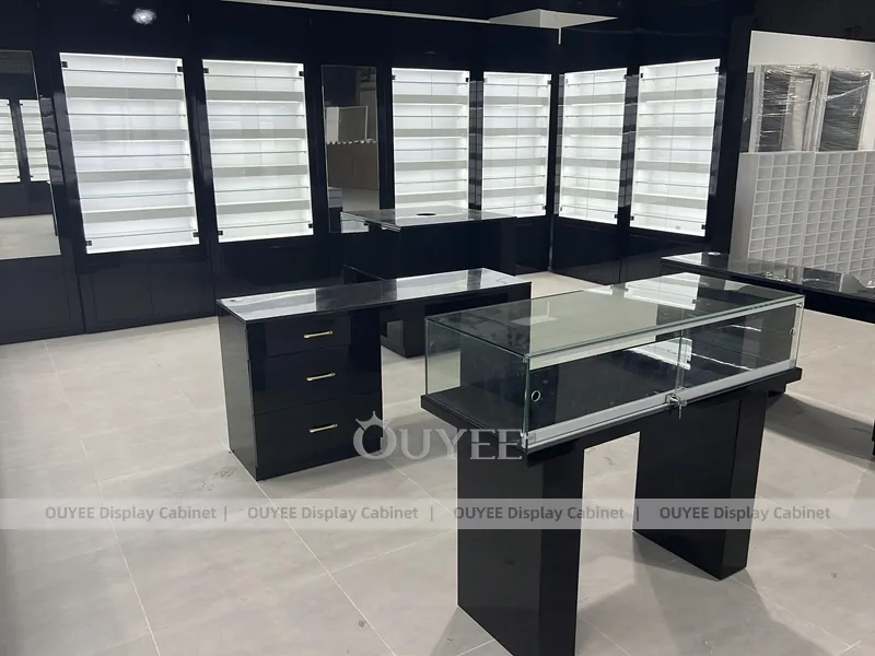 Black Optical Shop Interior with Illuminated Wall Shelves and Display Tables_07