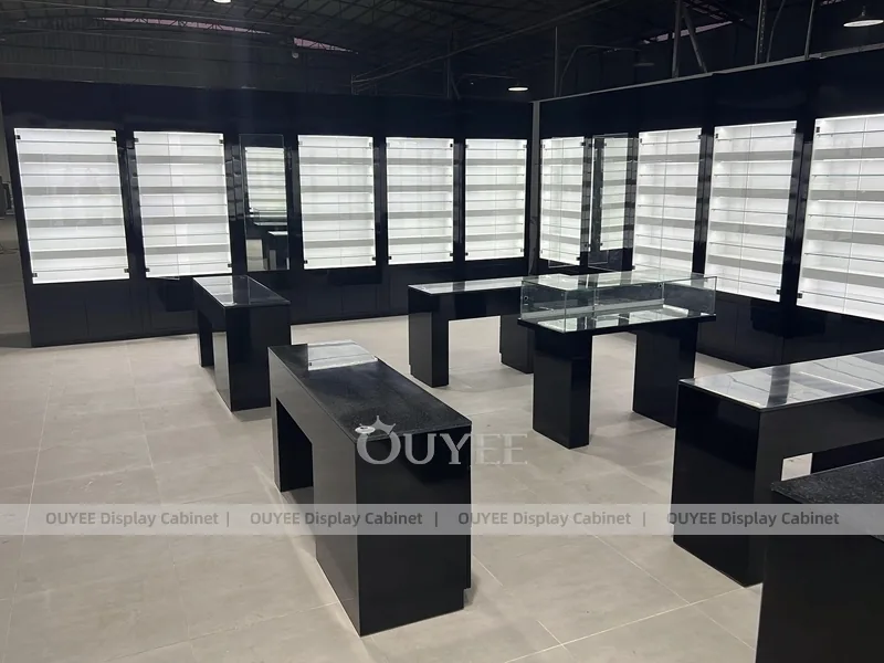 Black Optical Shop Interior with Illuminated Wall Shelves and Display Tables_08
