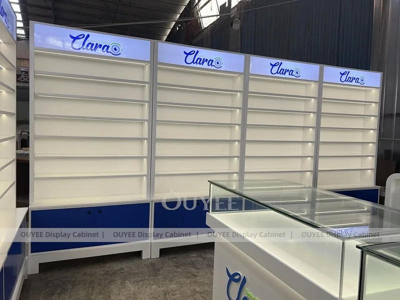 Branded Eyewear Display Wall with Blue Base Cabinets and Glass Counters_01