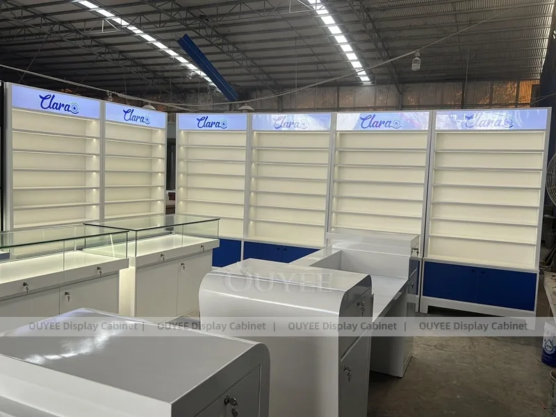 Branded Eyewear Display Wall with Blue Base Cabinets and Glass Counters_03