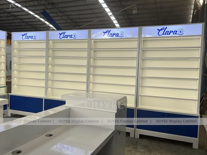 Branded Eyewear Display Wall with Blue Base Cabinets and Glass Counters_04