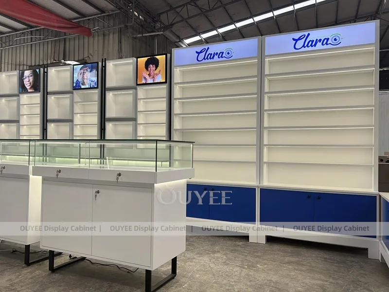 Branded Eyewear Display Wall with Blue Base Cabinets and Glass Counters_05