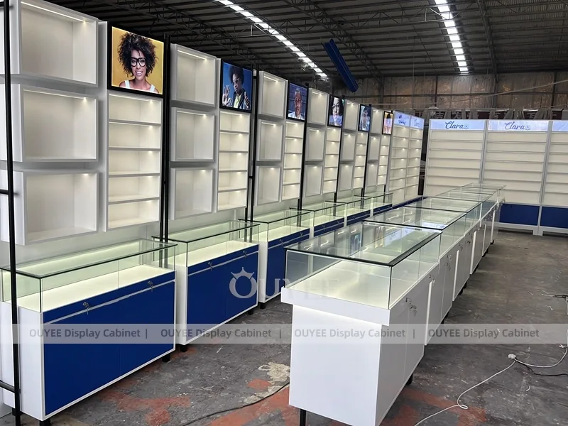 Branded Eyewear Display Wall with Blue Base Cabinets and Glass Counters_07