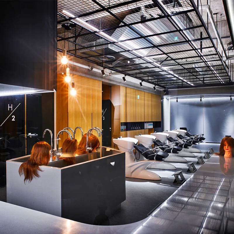 Industrial Salon Styling Table with Orange Chairs and Wood Partitions_02