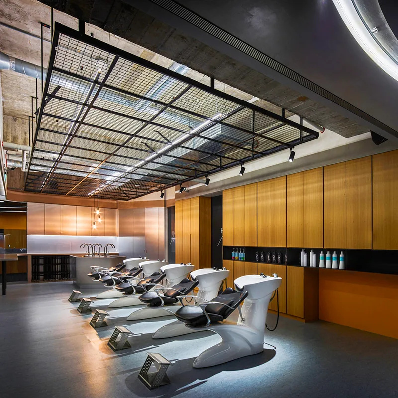 Industrial Salon Styling Table with Orange Chairs and Wood Partitions_03