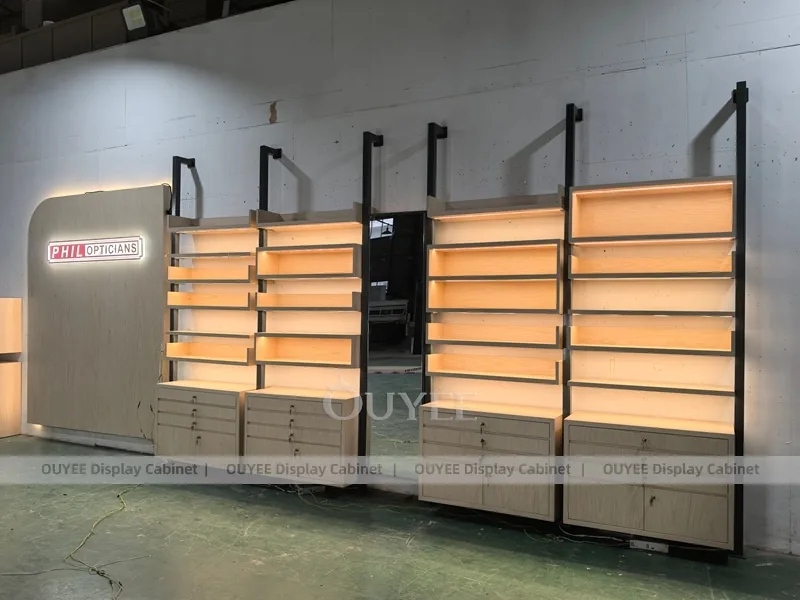 Luxury Optical Display Wall with Brand Panels and Accent Shelving_05
