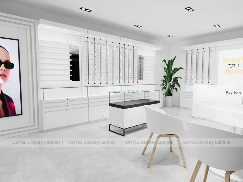 Design minimalista negozio ottico bianco con scrivania consulenza e mobili a parete_01