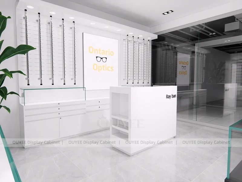 Design minimal bianco per negozio di ottica con scrivania per consulenze e armadi a parete_04