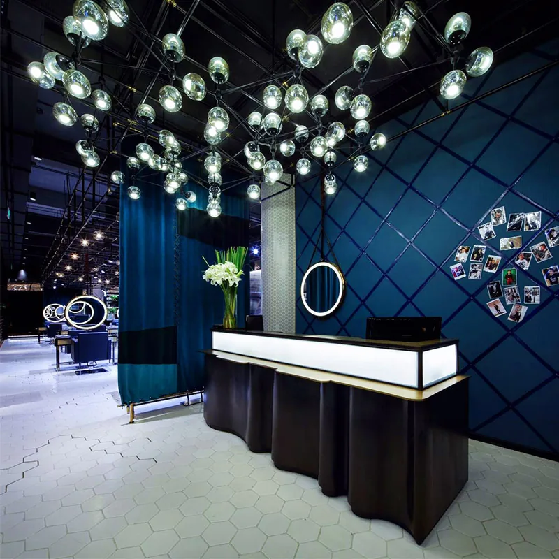 Modern Salon Interior with Circular Lighted Mirrors and Black Chairs_05