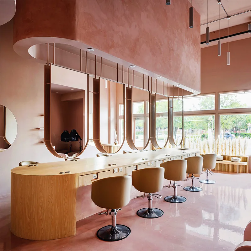 Postazioni di styling rosa per saloni con piani in legno e specchi rotondi_01