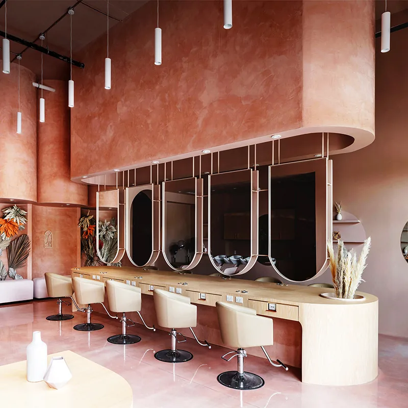 Rosa Salon-Stylingstationen mit Holztheken und runden Spiegeln_02
