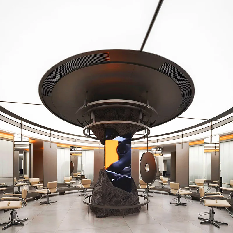 Isola centrale rotonda per styling in salone con sedie bianche_01