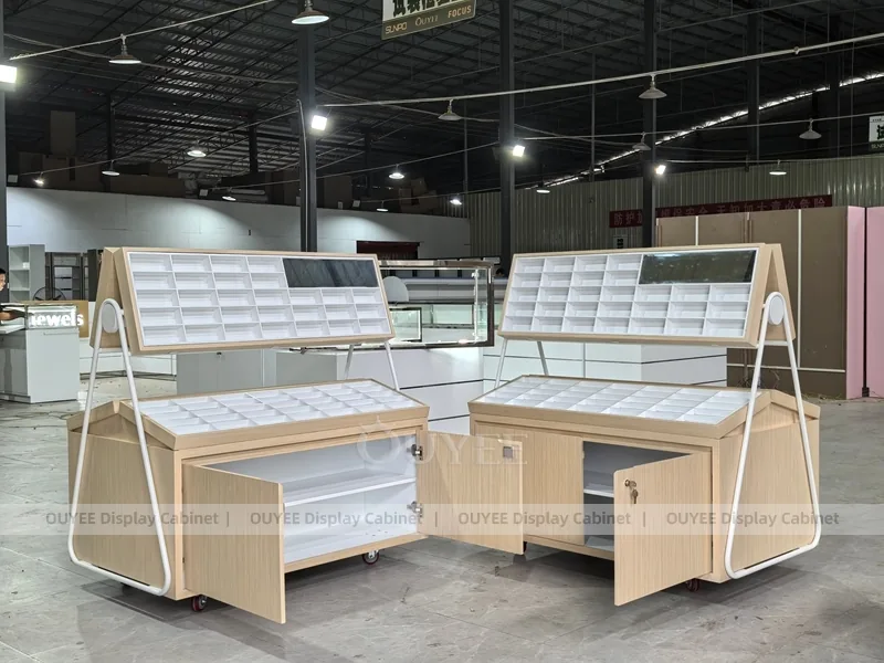 White Optical Display Island Counters with Angled Glass Tops_01