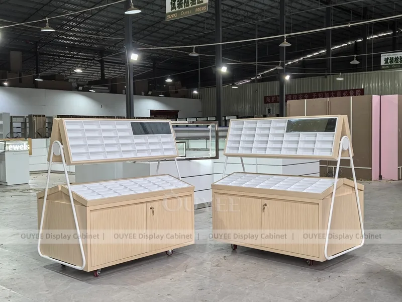 White Optical Display Island Counters with Angled Glass Tops_02
