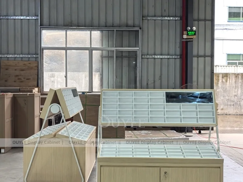 White Optical Display Island Counters with Angled Glass Tops_03