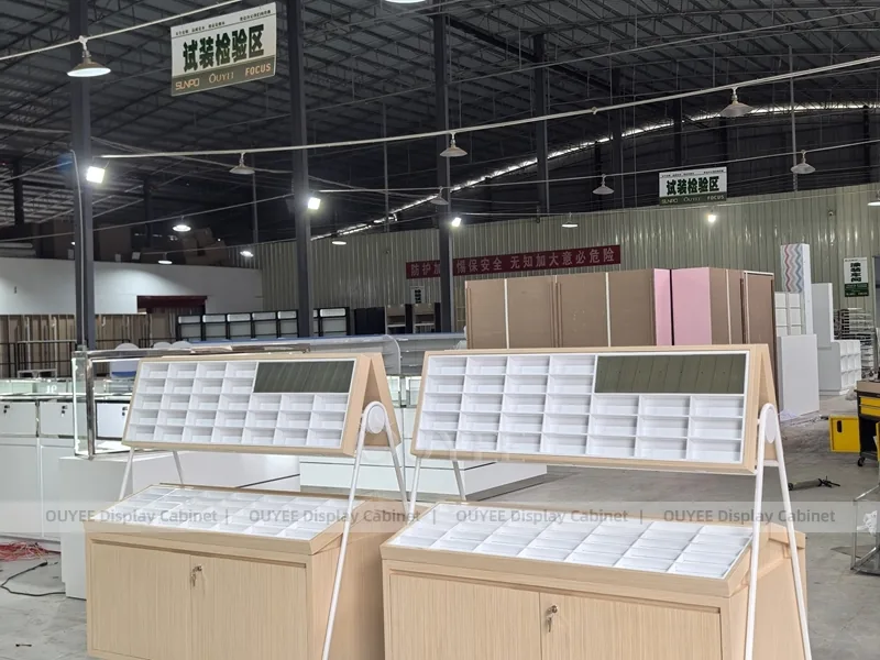 White Optical Display Island Counters with Angled Glass Tops_04