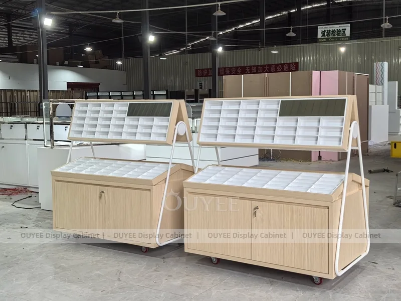 White Optical Display Island Counters with Angled Glass Tops_05