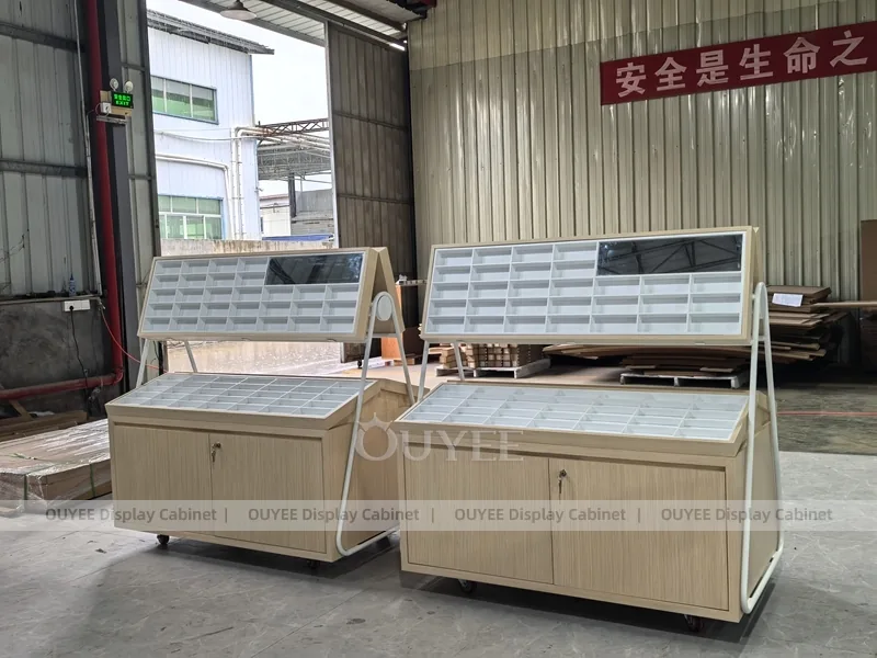 White Optical Display Island Counters with Angled Glass Tops_07