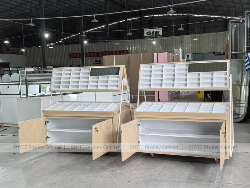 White Optical Display Island Counters with Angled Glass Tops_08