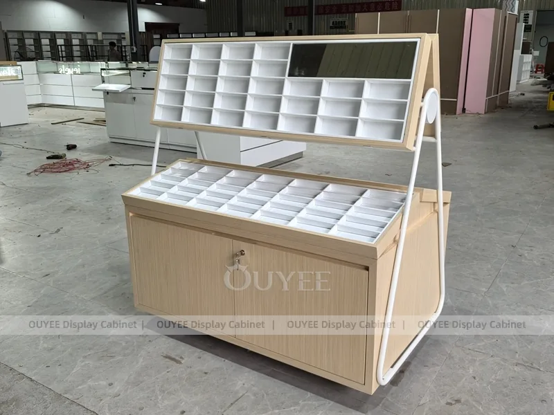 White Optical Display Island Counters with Angled Glass Tops_09