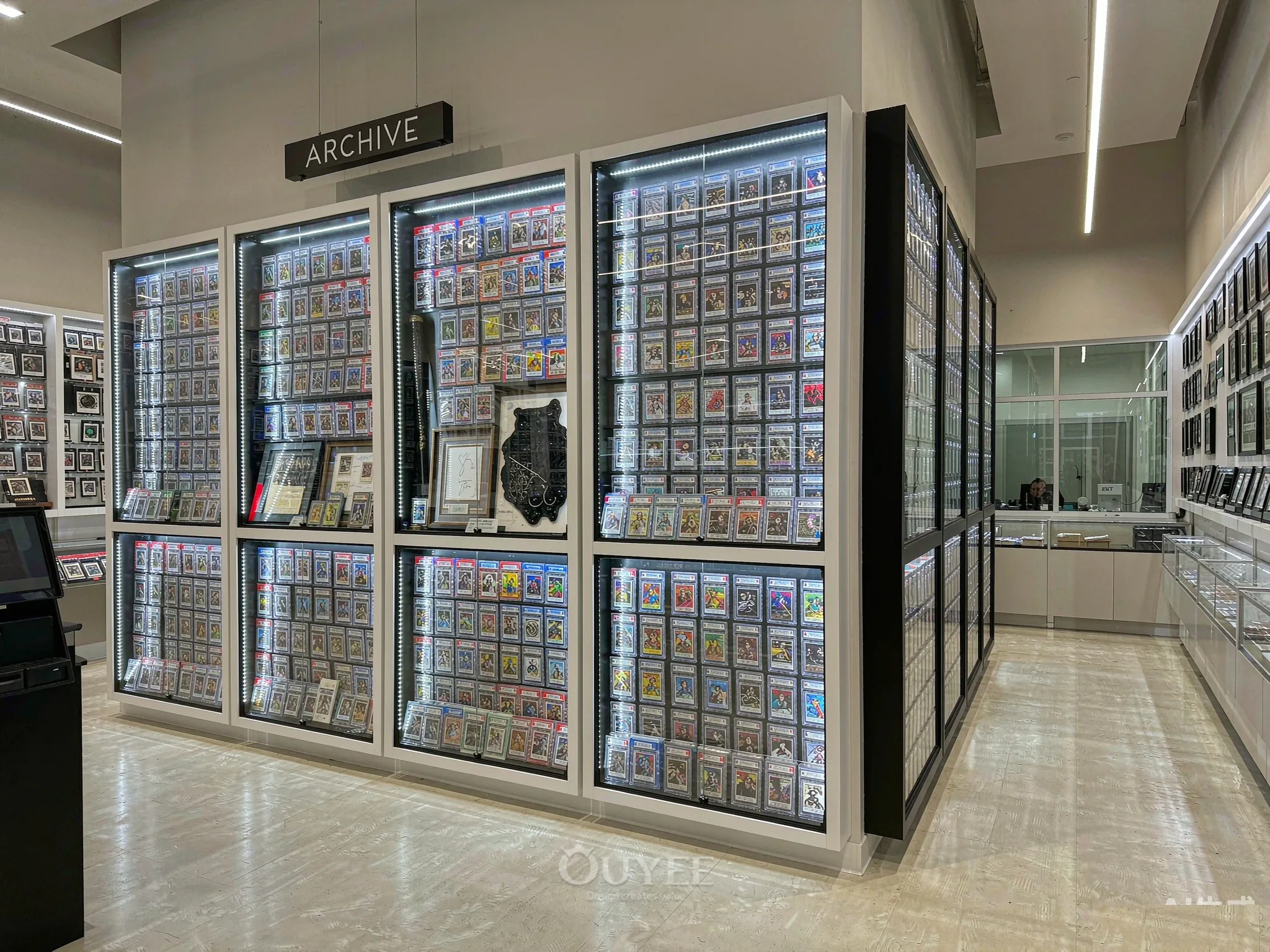 Blue Campus Trading Card Store Design interior with card display cabinets, view 1