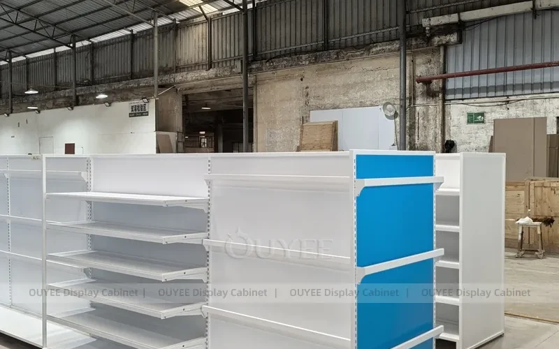 Blue and white retail gondola workshop photo with open shelving