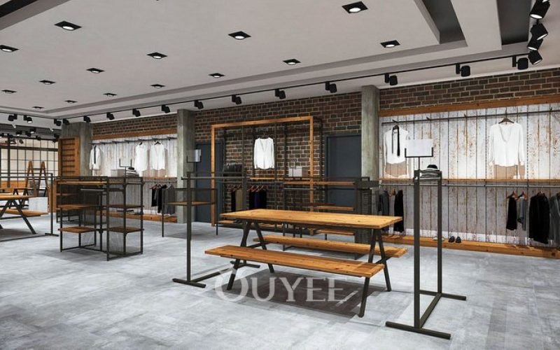 Clothing store design rendering with black garment rails and wood display tables