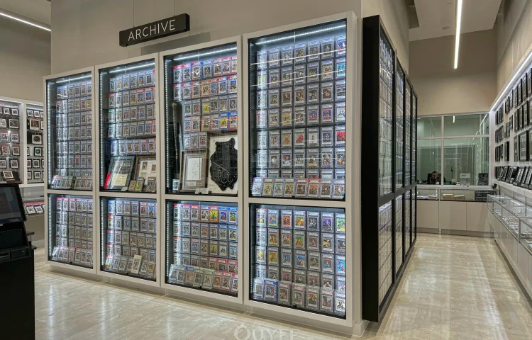 Blue Campus Trading Card Store Design interior with card display cabinets, view 1